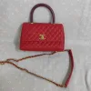 Elegant red leather purse with detachable gold chain and quilted design