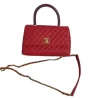 Elegant red leather purse with detachable gold chain and quilted design