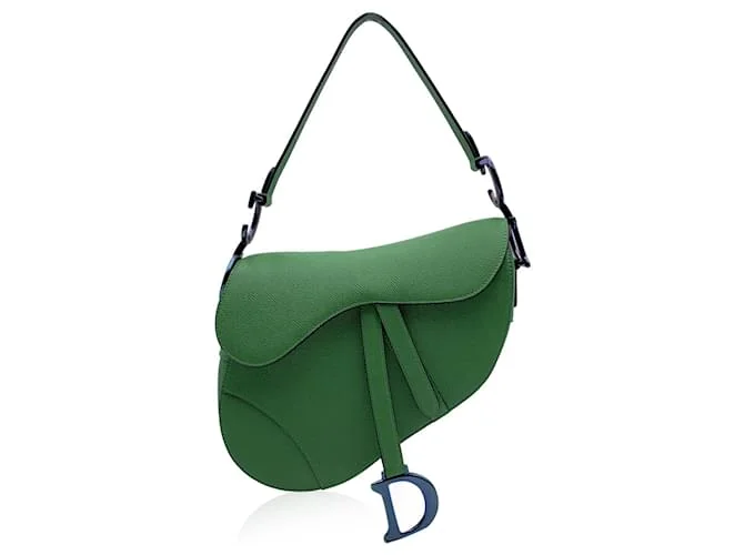 Classic Dior Saddle Bag featuring gold “D” charm and flap design