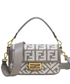 A pair of Fendi bags: leather mini tote and FF monogram shoulder bag, showcasing different textures.