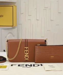 Model wearing the Fendigraphy WOC cross-body to show the length of the $54\text{ cm}$ chain strap drop.