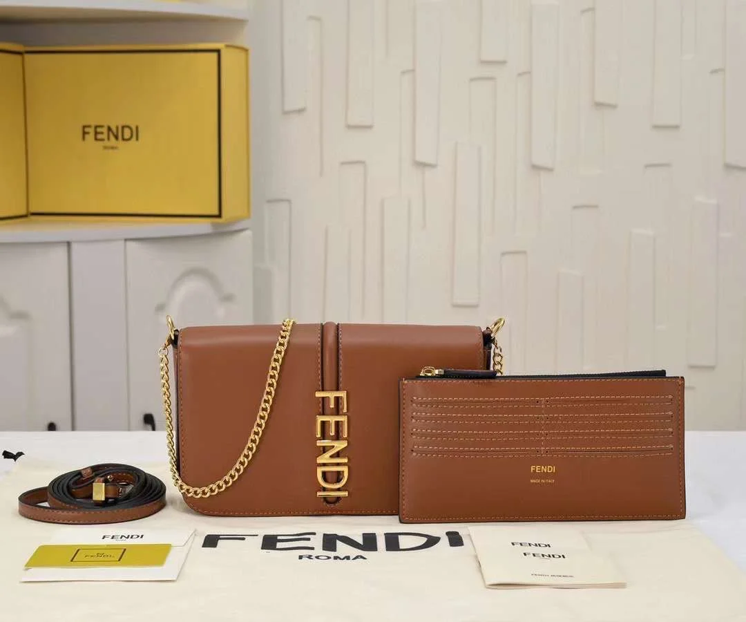 Fendigraphy-WOC-Crossbody-Style-View Model wearing the Fendigraphy WOC cross-body to show the length of the $54\text{ cm}$ chain strap drop.