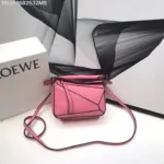 Loewe Puzzle bag crafted from calfskin leather with geometric stitched panels.
