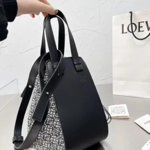 Full view of the Loewe Small Hammock bag in black calfskin and black/grey Anagram jacquard canvas, highlighting the top handles and detachable strap.