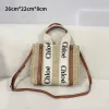 Small Chloé Woody woven basket bag with logo handles and brown leather trim
