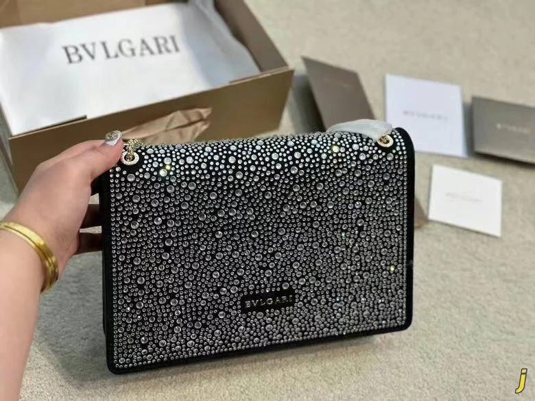 Bvlgari luxury shoulder Bags Bvlgari luxury shoulder bag, heavily embellished with crystals or rhinestones on a black background.