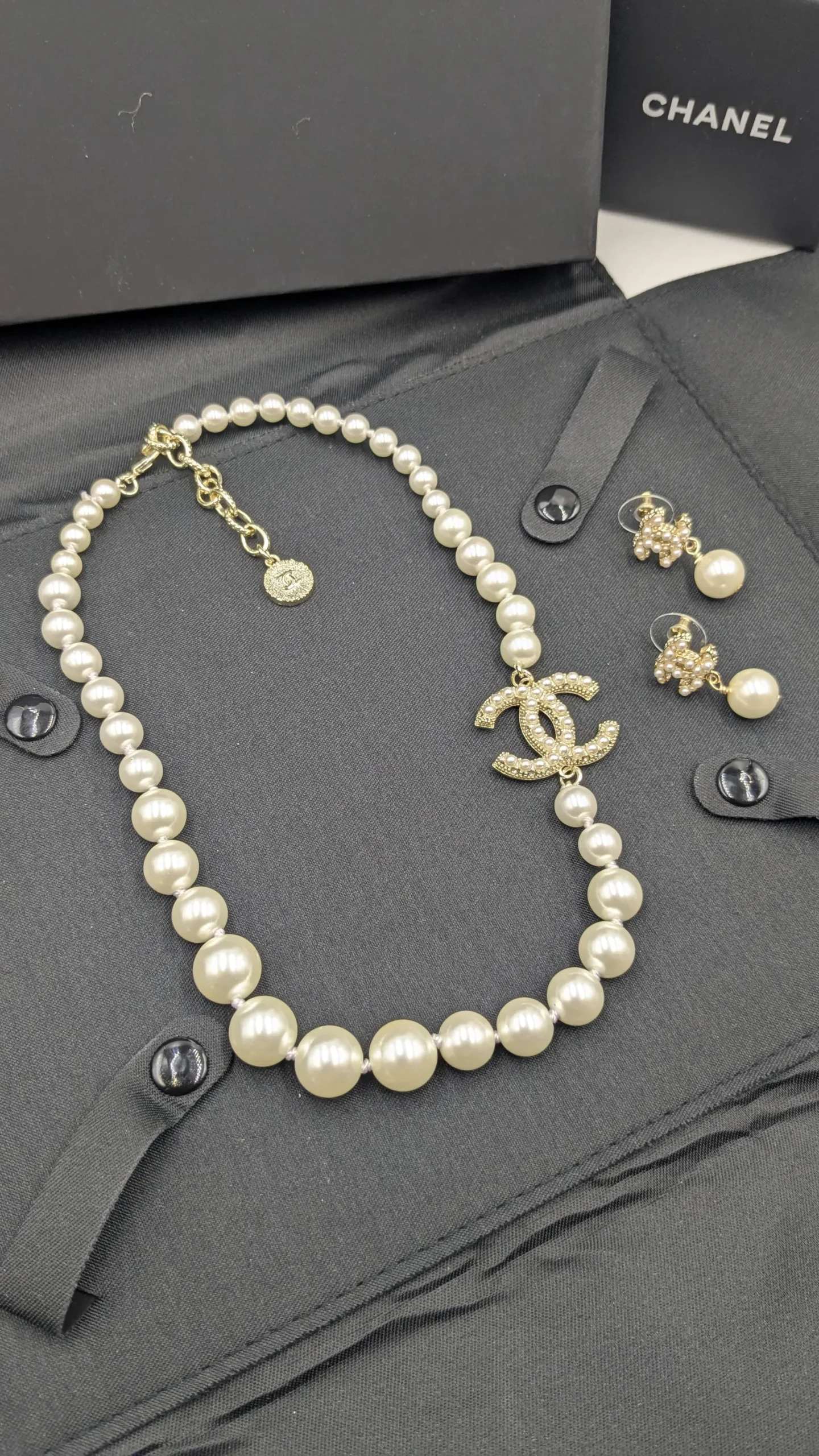 Elegant Bridal Pearl and Crystal CC Statement Jewelry Set Overhead product image of the full matching set, including the gold-tone, crystal-embellished CC earrings standing next to the long pearl necklace.