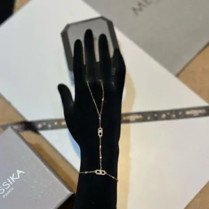 Finger-to-wrist hand chain crafted in rose gold with moving diamonds”