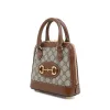 Luxury-inspired brown mini handbag with crossbody strap
