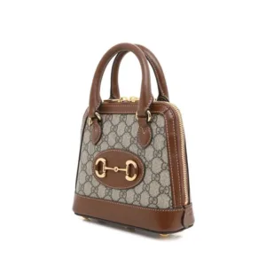 Luxury-inspired brown mini handbag with crossbody strap