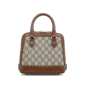 Compact top handle handbag in excellent condition on display