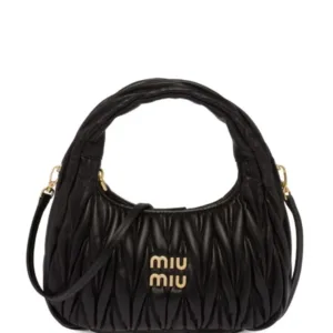 Black Miu Miu Mini Wander bag showing matelassé stitching and gold-tone logo lettering