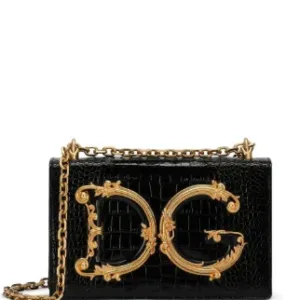 Front view of the Devotion mini bag with the large, ornate gold DG logo and chain strap.