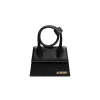 Mini Jacquemus handbag featuring structured shape and sculptural handle.