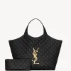 Large quilted leather shopping tote bag featuring a prominent metal monogram logo and soft top handles.