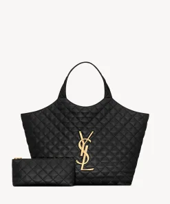 Large quilted leather shopping tote bag featuring a prominent metal monogram logo and soft top handles.