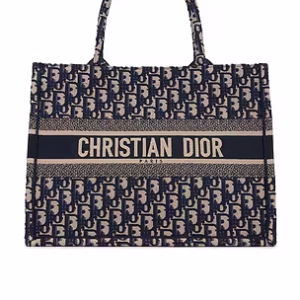 Detailed shot of the reinforced stitching and quality canvas material of a genuine Dior luxury tote.