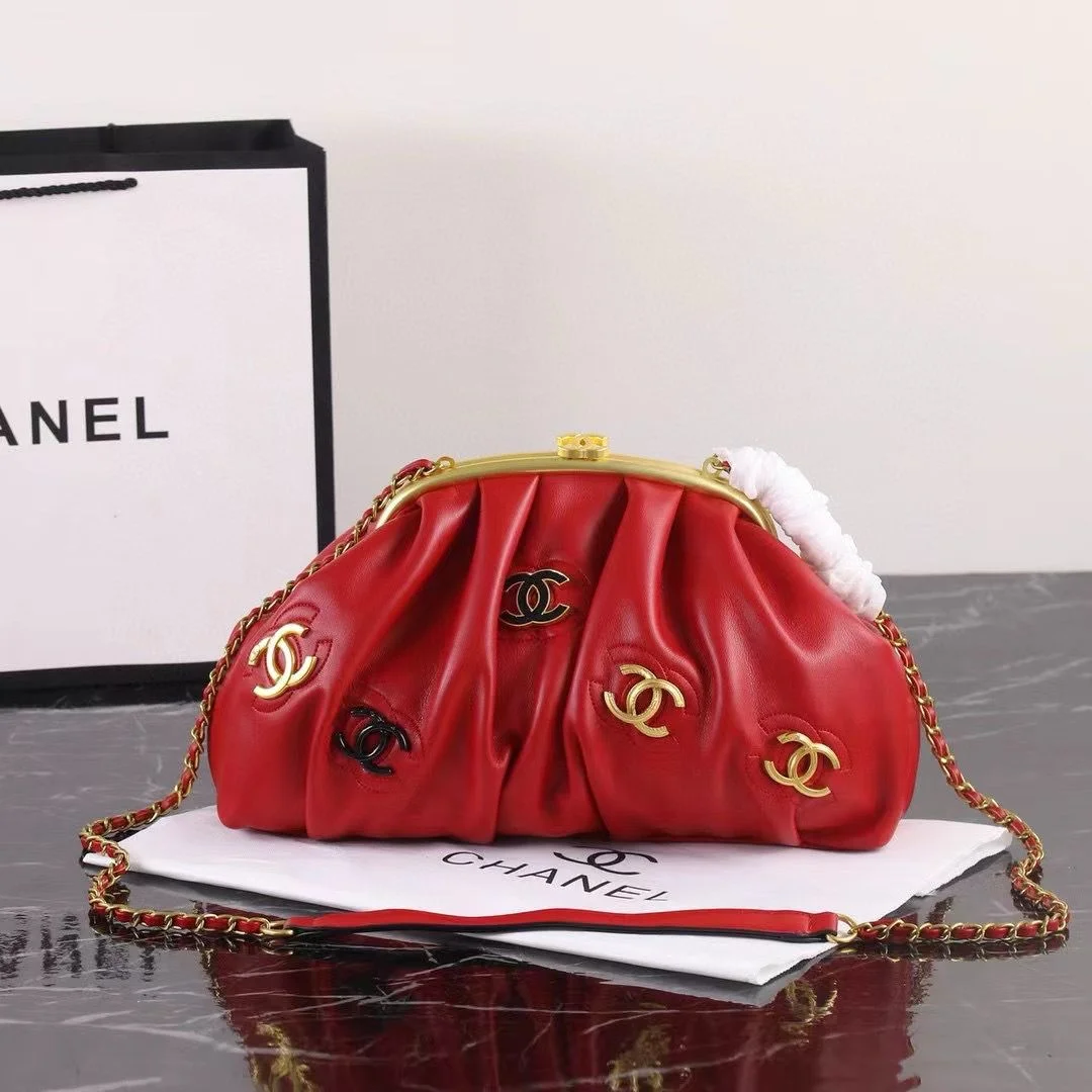 Red Pleated Leather Chain Shoulder Bag Red pleated leather handbag with gold chain strap and decorative metallic accents