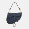 Dior Saddle Bag with curved silhouette and magnetic flap closure