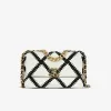 Chanel 19 small flap bag front view in white calfskin with black crochet stitching