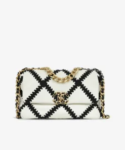 Chanel 19 small flap bag front view in white calfskin with black crochet stitching