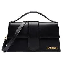 Top-handle black leather Jacquemus bag highlighting its structured shape.