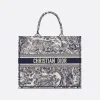 Full view of the Dior Book Tote in blue and white Toile de Jouy Sauvage jungle print canvas