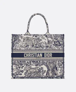 Full view of the Dior Book Tote in blue and white Toile de Jouy Sauvage jungle print canvas