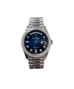18k blue Rolex Day-Date watch with sparkling diamond bezel