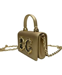 Side view of Metallic Gold Dolce & Gabbana Devotion Mini Top Handle Bag showing croc-embossed leather and DG logo