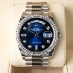 18k yellow gold Rolex Day-Date President watch with diamond bezel and classic dial.