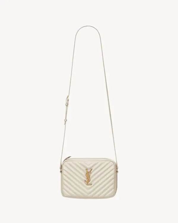 Close-up of a small women's quilted leather handbag, showcasing the fine chevron pattern and gold-tone hardware.