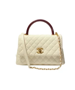 Side view of Chanel Coco Handle Medium handbag in white cream Caviar leather