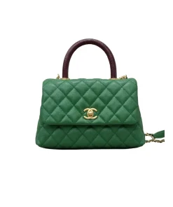 Gold-tone CC turn-lock hardware on Chanel Coco Handle Medium bag