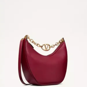 Medium-sized red grainy calfskin VLogo Moon hobo bag featuring a large gold chain shoulder strap with VLogo hardware.