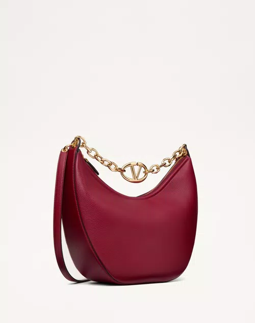 Vlogo-Moon-Medium-Grainy-Calfskin-Hobo-Bag-With-Chain (1) Medium-sized red grainy calfskin VLogo Moon hobo bag featuring a large gold chain shoulder strap with VLogo hardware.