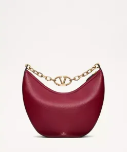 Red grainy leather Valentino Garavani structured top handle bag with pink jewel VLogo Signature and gold chain strap.