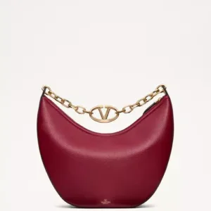 Red grainy leather Valentino Garavani structured top handle bag with pink jewel VLogo Signature and gold chain strap.