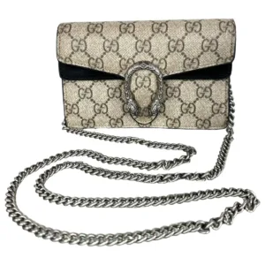 Luxury-inspired suede-trim shoulder bag featuring chain strap