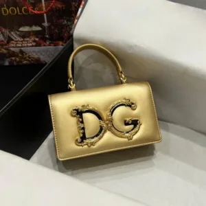 Front view of the gold Devotion mini bag with the large, ornate gold DG logo and top handle.