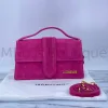 Elegant pink Jacquemus purse with minimalist design and smooth leather texture.