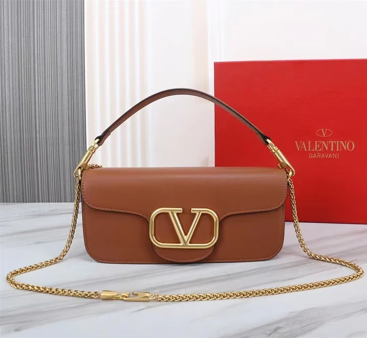Valentino VLogo Signature Bag Front Front view of a luxurious smooth leather Valentino Garavani shoulder bag with a prominent gold VLogo signature and a fine gold chain strap.