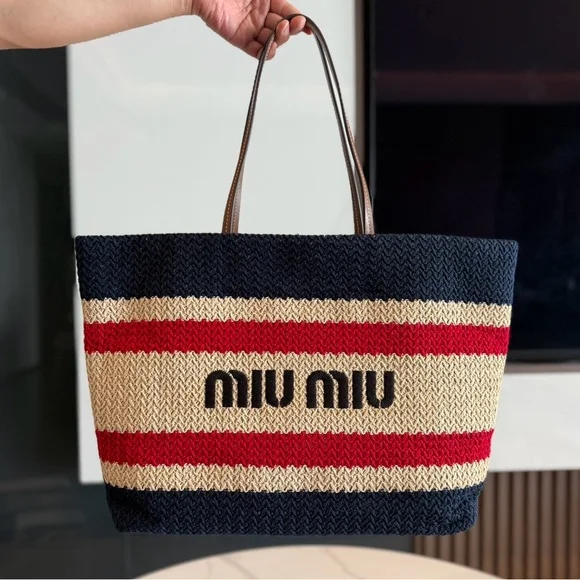 Stylish Woven Handbag by Miu Miu Close-up of Miu Miu woven tote bag with decorative stripes and structured shape.
