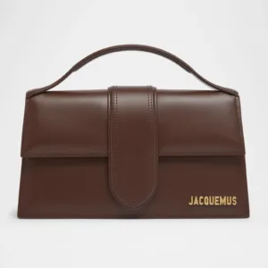 Close-up of Jacquemus handbag stitching and gold branding.