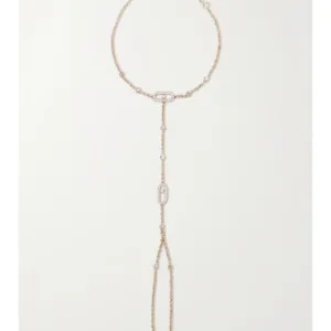 Close-up of 18K rose gold hand chain with floating diamond detail”