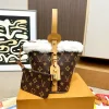 Louis Vuitton All In BB shoulder bag in classic brown Monogram coated canvas with gold-tone hardware and leather straps
