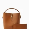 Side profile of LE 37 mini bucket bag showing bronze-toned hardware and suede lining.