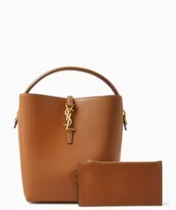 Side profile of LE 37 mini bucket bag showing bronze-toned hardware and suede lining.