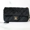 Chanel gray quilted felt flap bag featuring brown leather woven chain strap and interlocking CC lock