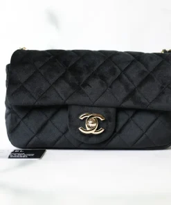 Chanel gray quilted felt flap bag featuring brown leather woven chain strap and interlocking CC lock